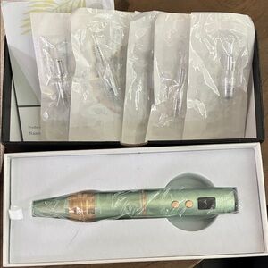 Green and Gold micro-needling pen.